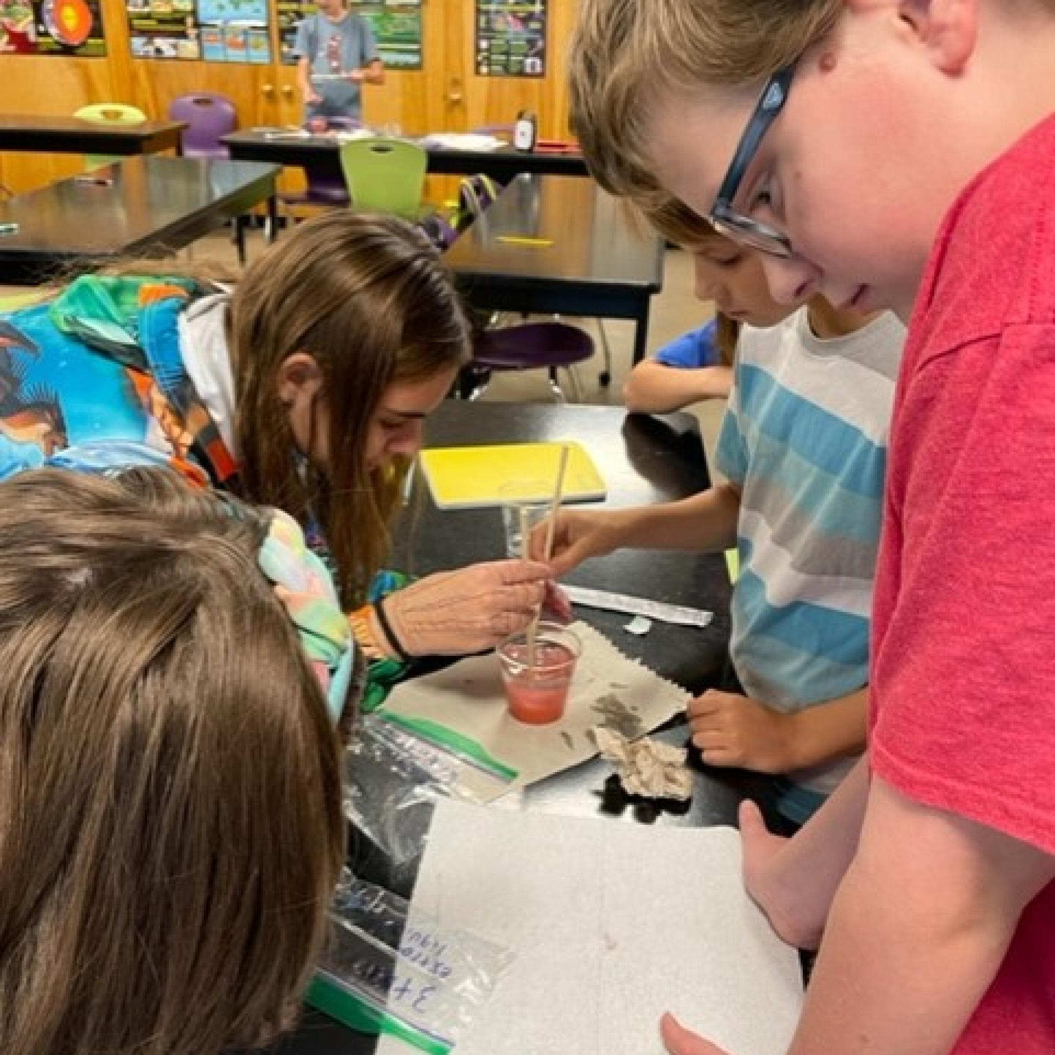 Middle school students experimenting in class
